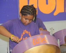 Dominique playing her steelpan drum!