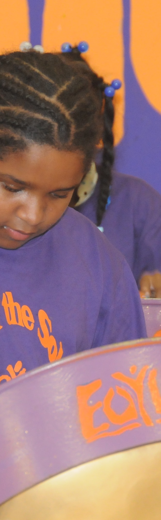Dominique playing her steelpan drum!
